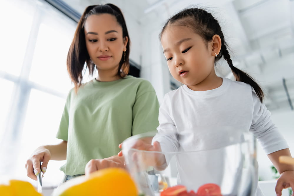 picture of mother and daughter cooking in the kitchen
