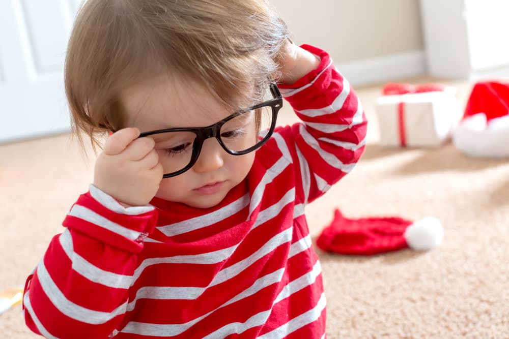 picture of toddler boy with striped shirt and glasses