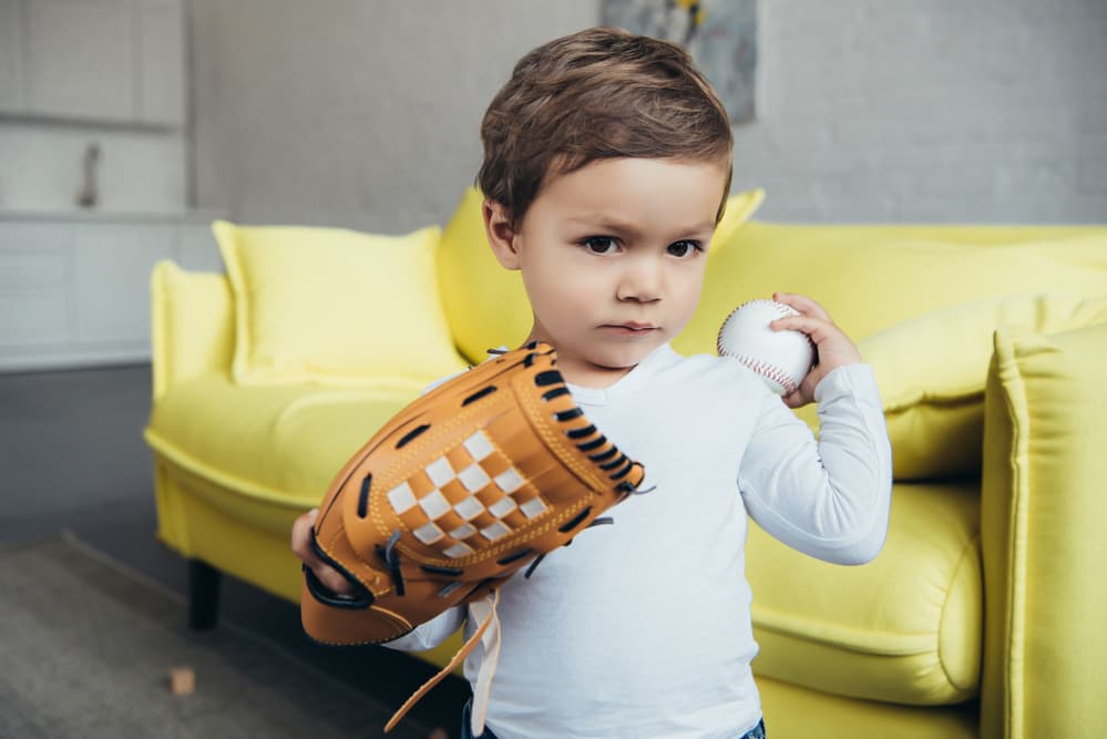 picture of toddler boy with a baseball mit and baseball