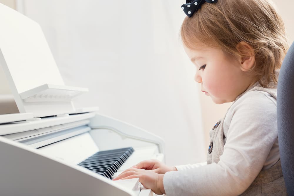 little girl playing the piano