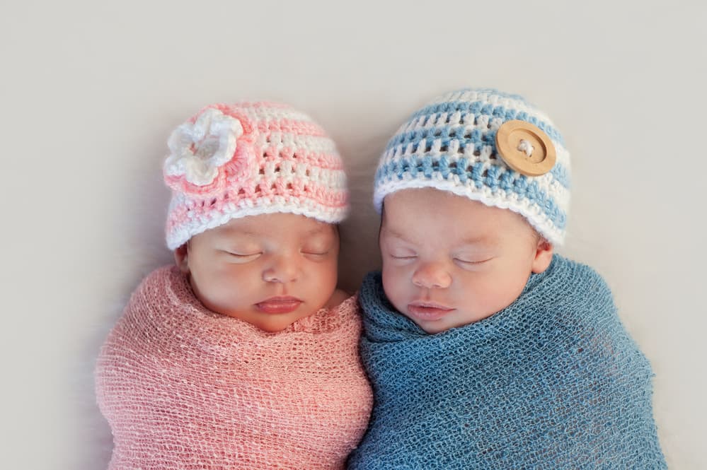 picture of twin baby girl and baby boy sleeping side by side